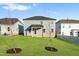 A spacious backyard is complemented with two newly planted trees and views of neighboring homes at 808 Challenger Ln, Knightdale, NC 27545