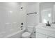 Well-lit full bath featuring a shower-tub combo, toilet, and modern vanity at 808 Challenger Ln, Knightdale, NC 27545