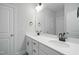 Bright bathroom featuring double sinks, white cabinets, and quartz countertops at 808 Challenger Ln, Knightdale, NC 27545