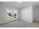 Bedroom with neutral carpet, natural light and view to the outdoors at 808 Challenger Ln, Knightdale, NC 27545