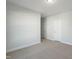 Neutral carpet, natural light and a closet door in an empty bedroom at 808 Challenger Ln, Knightdale, NC 27545