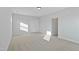 Bright bedroom with neutral carpet, double door closet, and a ceiling light at 808 Challenger Ln, Knightdale, NC 27545