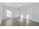 This bedroom features wood-look floors, a ceiling fan, and multiple doors for closet/bathroom access at 808 Challenger Ln, Knightdale, NC 27545