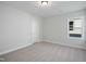 Bright bedroom featuring neutral carpeting, base trim, and a double hung window at 808 Challenger Ln, Knightdale, NC 27545