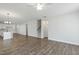 Open-concept living area with wood-look flooring connecting to the kitchen with island seating at 808 Challenger Ln, Knightdale, NC 27545