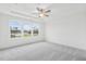 Bright bedroom features wall-to-wall carpet and large windows at 448 Billingshurst Way, Knightdale, NC 27545