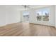 Spacious bedroom with light hardwood floors and access to a private balcony at 448 Billingshurst Way, Knightdale, NC 27545