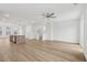 Open concept living room with hardwood floors and a view to the kitchen at 448 Billingshurst Way, Knightdale, NC 27545