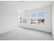 Bright bedroom with large windows that have neighborhood views at 506 Billingshurst Way, Knightdale, NC 27545
