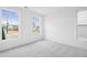 Empty room with carpet and two windows, allowing natural light at 506 Billingshurst Way, Knightdale, NC 27545