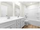 Bathroom featuring a double sink vanity and shower and tub combination at 8905 Stratus St, Willow Springs, NC 27592