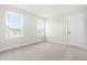 Bedroom featuring a neutral color palette, plush carpeting and natural light from multiple windows at 8905 Stratus St, Willow Springs, NC 27592