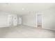 Spacious bedroom featuring neutral walls, plush carpeting, and abundant natural light at 8905 Stratus St, Willow Springs, NC 27592