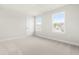 Bedroom featuring a neutral color palette, plush carpeting and natural light from multiple windows at 8905 Stratus St, Willow Springs, NC 27592