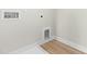 Functional laundry room with white cabinets, vinyl floors and modern hookups at 8905 Stratus St, Willow Springs, NC 27592