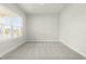 Room with large window and neutral carpet at 8905 Stratus St, Willow Springs, NC 27592