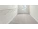 Bright walk-in closet with carpet and wire shelving for ample storage at 8905 Stratus St, Willow Springs, NC 27592