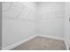 Neutral carpeted walk-in closet with white wire shelving at 1005 Bostonian Dr, Knightdale, NC 27545