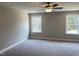 Spacious bedroom with carpet and large windows at 5008 Trotter Dr, Raleigh, NC 27603