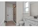 Bathroom with white vanity, shower, and tile flooring at 5017 Trotter Dr, Raleigh, NC 27603