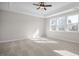 Large bedroom with carpeted floor and ceiling fan at 5017 Trotter Dr, Raleigh, NC 27603