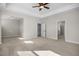 Main bedroom with carpet, ceiling fan and access to bathroom and sitting area at 5017 Trotter Dr, Raleigh, NC 27603