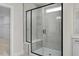 Large walk-in shower with marble tile and built-in seat at 5017 Trotter Dr, Raleigh, NC 27603