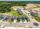 Aerial view of a new development showing several modern homes, landscaping, and community layout at 8869 Tartan Clan Dr, Willow Springs, NC 27592