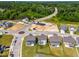 Aerial view of new homes in a planned community, showing landscaping and cul-de-sac layout at 8869 Tartan Clan Dr, Willow Springs, NC 27592