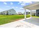 View from covered patio overlooking spacious yard in residential area at 8869 Tartan Clan Dr, Willow Springs, NC 27592