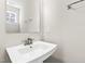Bathroom featuring a sink, mirror, and towel rack with modern fixtures and finishes at 8869 Tartan Clan Dr, Willow Springs, NC 27592