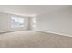 Bright bedroom with plush carpet, neutral walls and two windows offering plenty of natural light at 8869 Tartan Clan Dr, Willow Springs, NC 27592