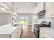 Spacious kitchen featuring stainless steel appliances, granite counters and a large island at 8869 Tartan Clan Dr, Willow Springs, NC 27592