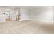 Large living room with neutral carpet, staircase, and an open concept design at 8869 Tartan Clan Dr, Willow Springs, NC 27592