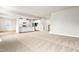 Spacious living area with an open floor plan, lots of natural light, and adjoining kitchen with bar seating at 8869 Tartan Clan Dr, Willow Springs, NC 27592
