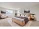 Serene main bedroom offers natural light and calming decor, creating a relaxing retreat at 8869 Tartan Clan Dr, Willow Springs, NC 27592