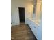 Bathroom featuring double sink vanity with granite counters and modern fixtures at 135 Ironwood Blvd # 49, Youngsville, NC 27596