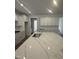 Modern kitchen featuring white cabinets, large center island, and stainless steel oven at 135 Ironwood Blvd # 49, Youngsville, NC 27596