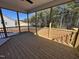 Screened-in porch has ceiling fan and views of the trees and backyard from the wood floors at 135 Ironwood Blvd # 49, Youngsville, NC 27596