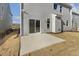 Home's rear elevation showcasing a patio and grassy yard at 18 Steppe Way, Garner, NC 27529