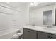 Bathroom with double vanity, large mirror and a shower/tub combo at 18 Steppe Way, Garner, NC 27529