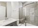 Clean bathroom with gray tile shower and vanity at 18 Steppe Way, Garner, NC 27529