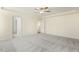 Large bedroom with carpeted floor, ceiling fan and access to bathroom at 18 Steppe Way, Garner, NC 27529