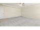 Well-lit bedroom with carpeted floor and ceiling fan at 18 Steppe Way, Garner, NC 27529