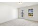 Bright bedroom with carpet flooring, access to balcony, and neutral walls at 18 Steppe Way, Garner, NC 27529