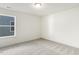 Simple bedroom with carpeted floor, large window, and neutral walls at 18 Steppe Way, Garner, NC 27529