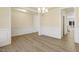 Bright dining room with hardwood floors and chandelier at 18 Steppe Way, Garner, NC 27529