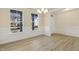 Bright dining room with hardwood floors, chandelier, and wainscoting at 18 Steppe Way, Garner, NC 27529