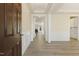 Bright entryway with hardwood floors and view of the living room at 18 Steppe Way, Garner, NC 27529