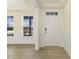 Bright entryway with hardwood floors and wainscoting at 18 Steppe Way, Garner, NC 27529
